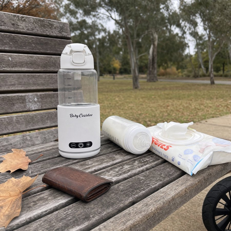 Babycozidoo on a park bench with autumn leaves during a walk