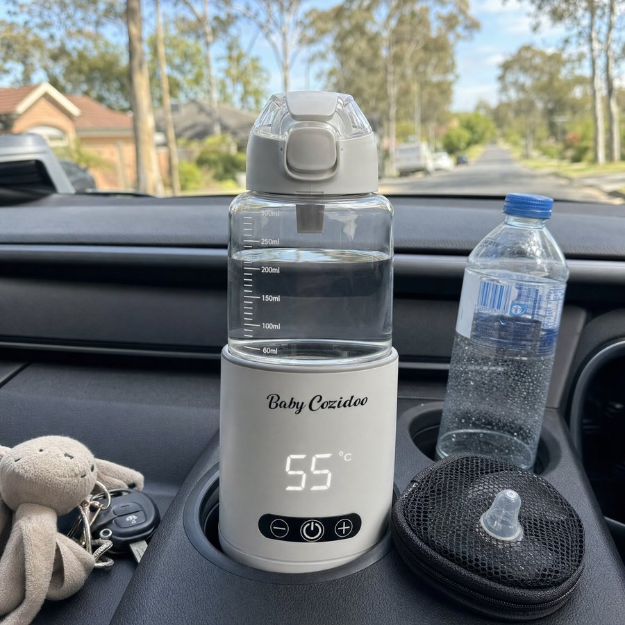 Babycozidoo bottle warmer in a car cupholder during the daycare school run