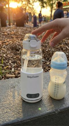 Babycozidoo holding a baby bottle at perfect 37 during an Australian park sunset